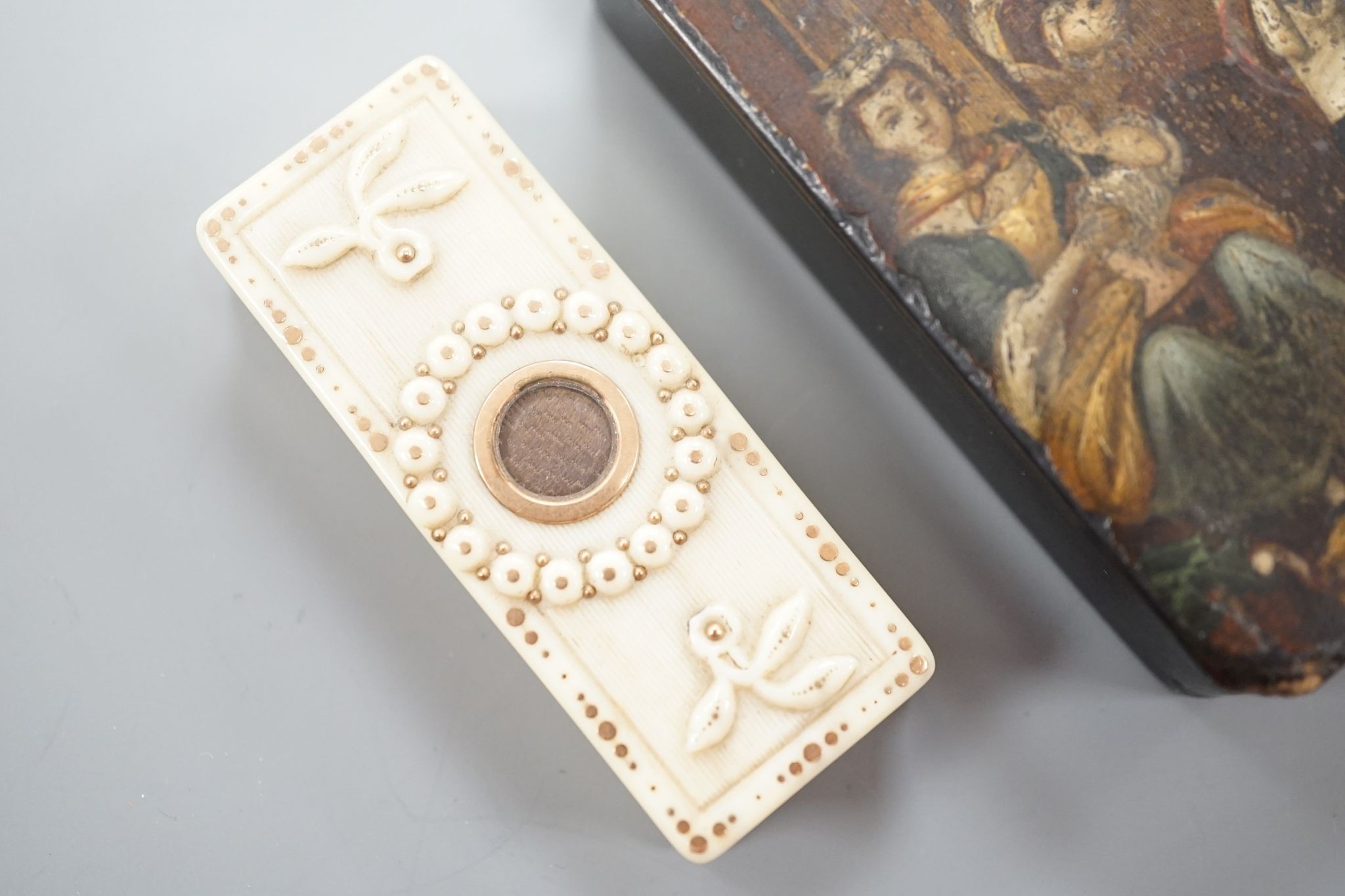 A 19th century papier mache snuff box and a similar carved ivory toothpick box, snuff box 5 cms wide x 8 cms high.